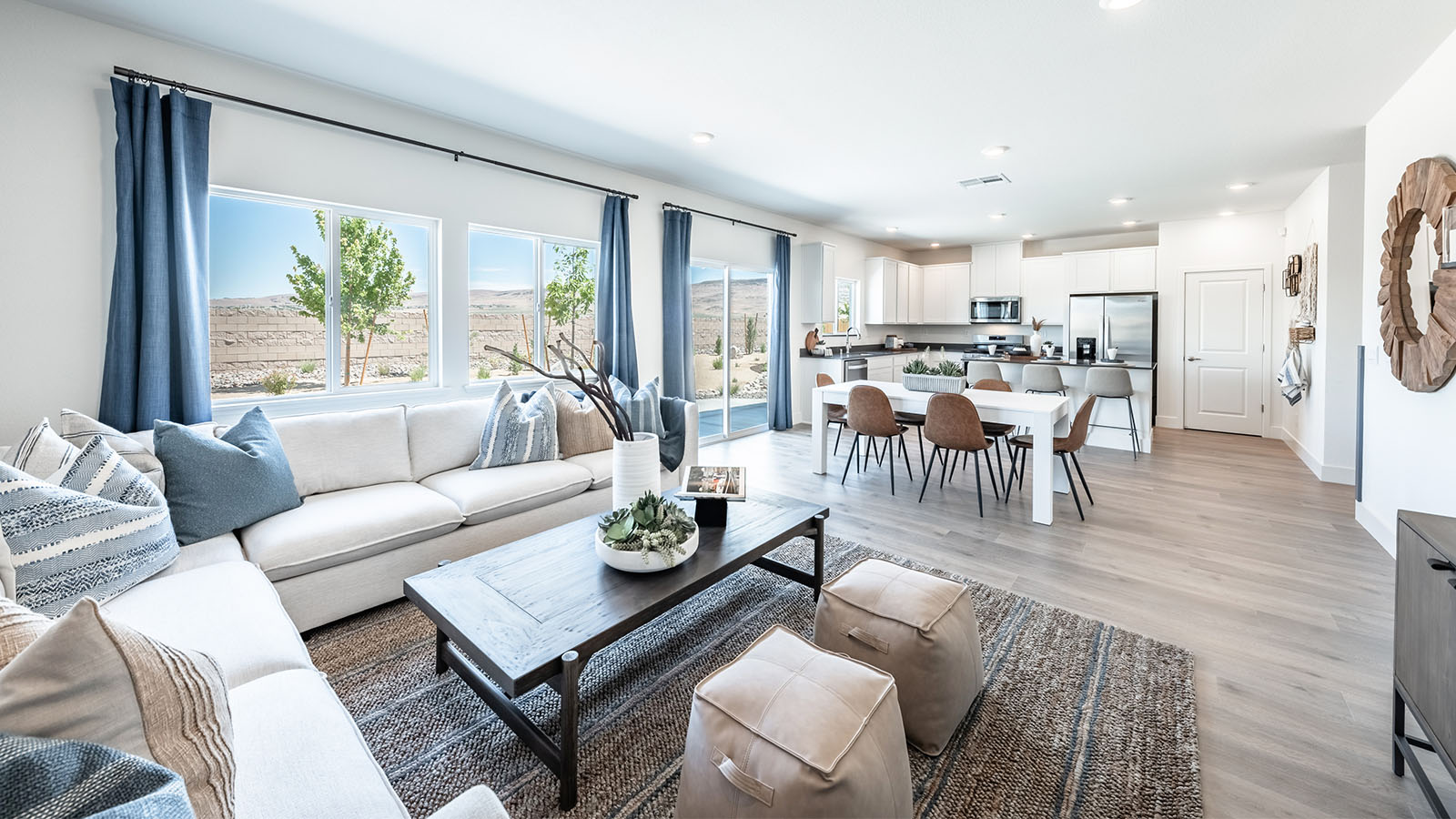 Open concept living area with kitchen, dining area and living room