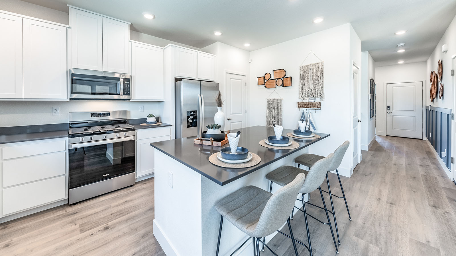 Bright modern kitchen with island and shaker style cabinets