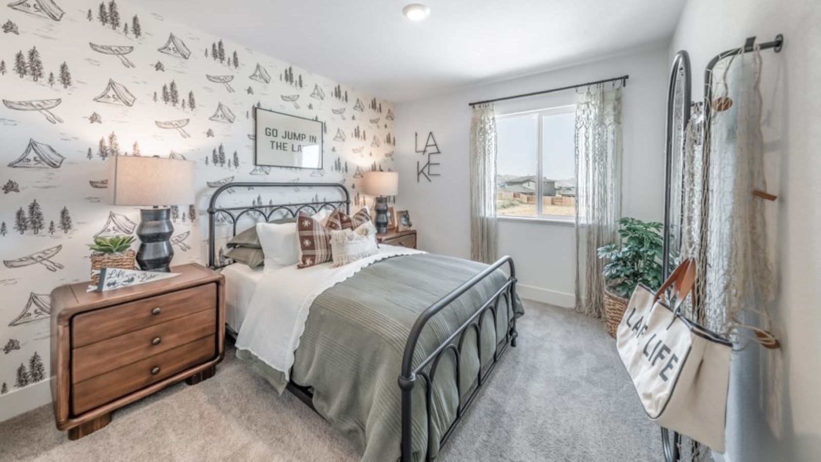 Bedroom decorated for a teen with a large window and carpeted floor