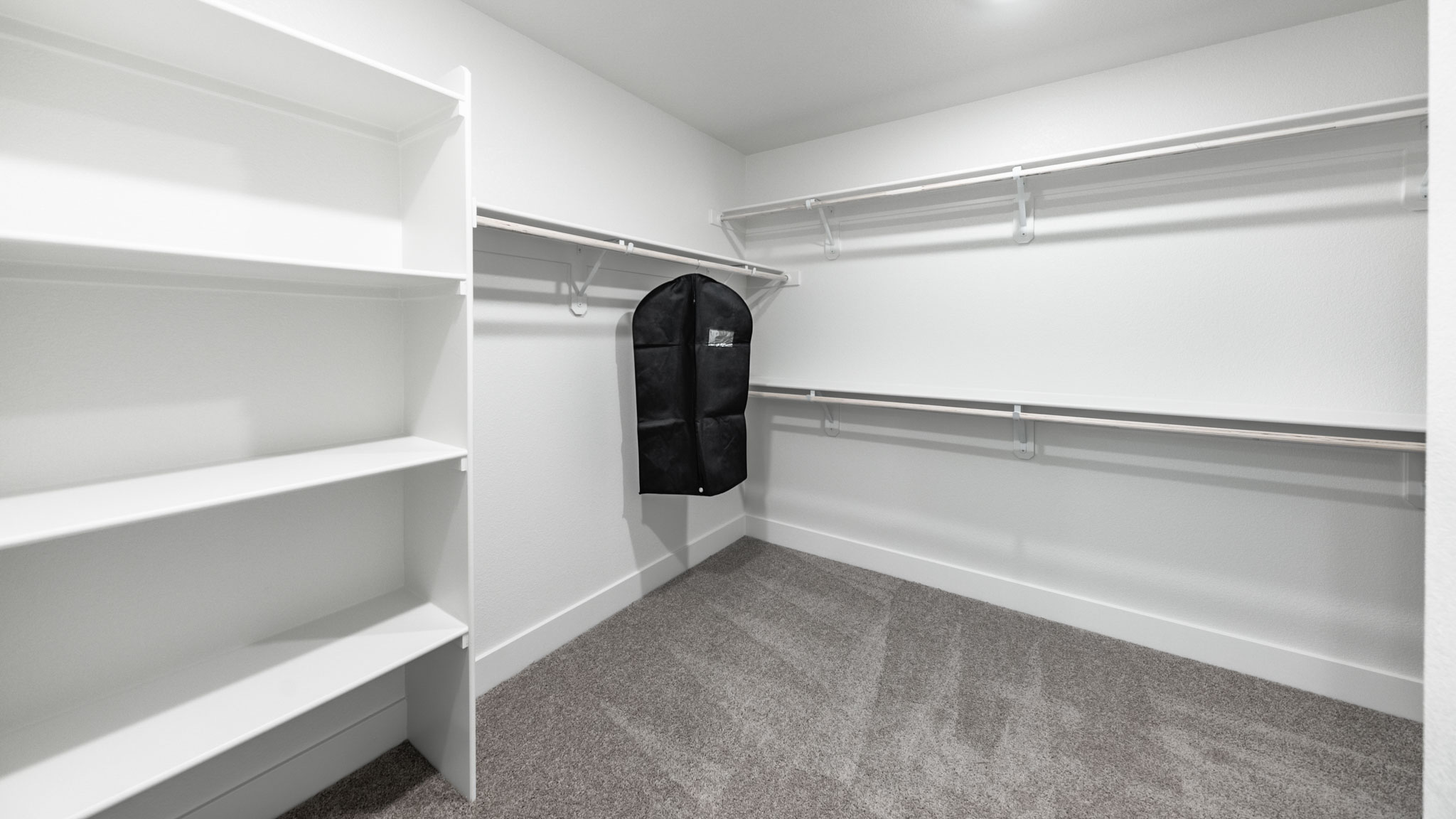 Large walk-in closet with built-in shelves