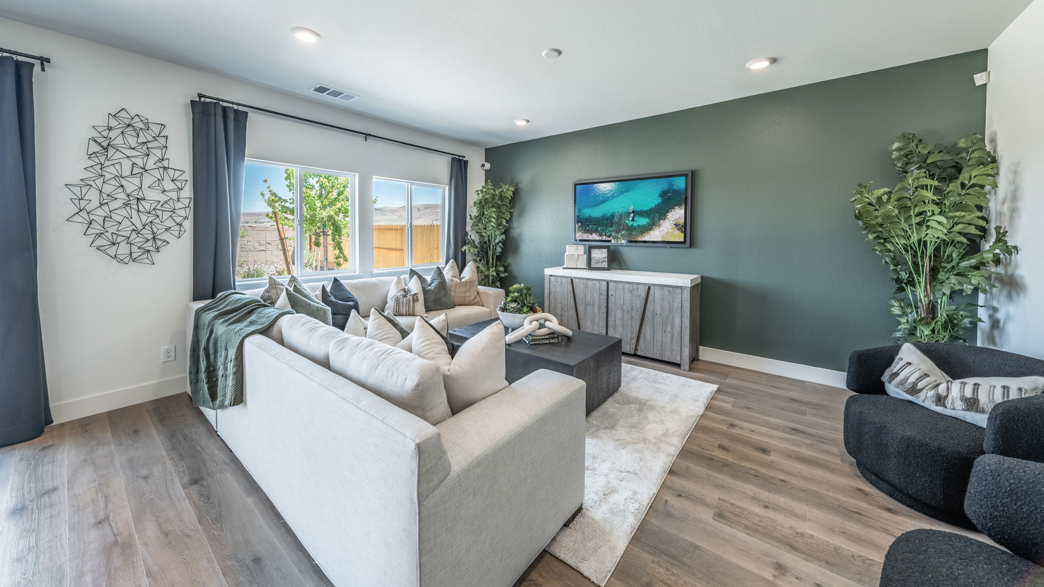Modern living room with windows looking out into back yard