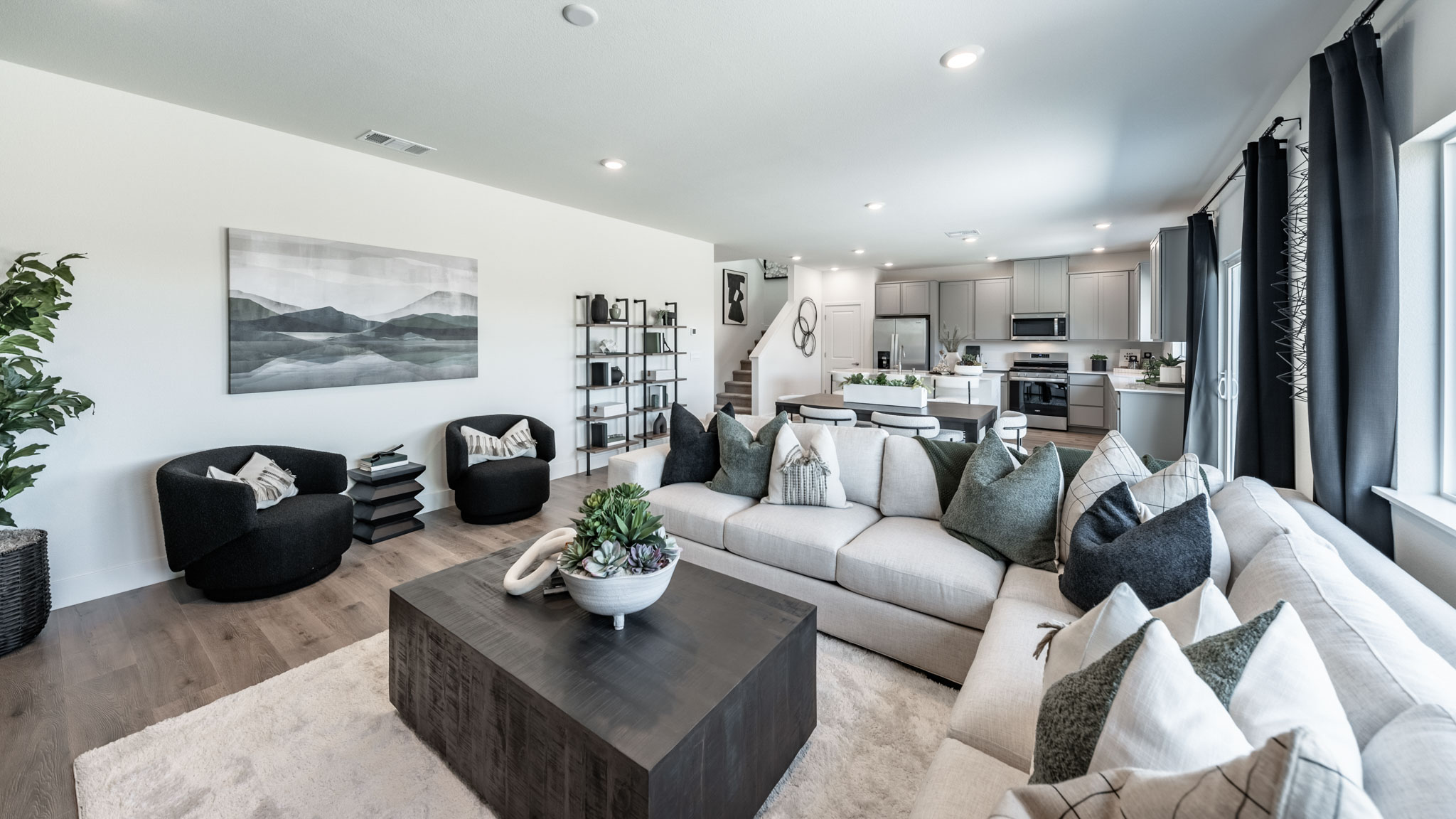 Open-concept first floor living room with bright natural light