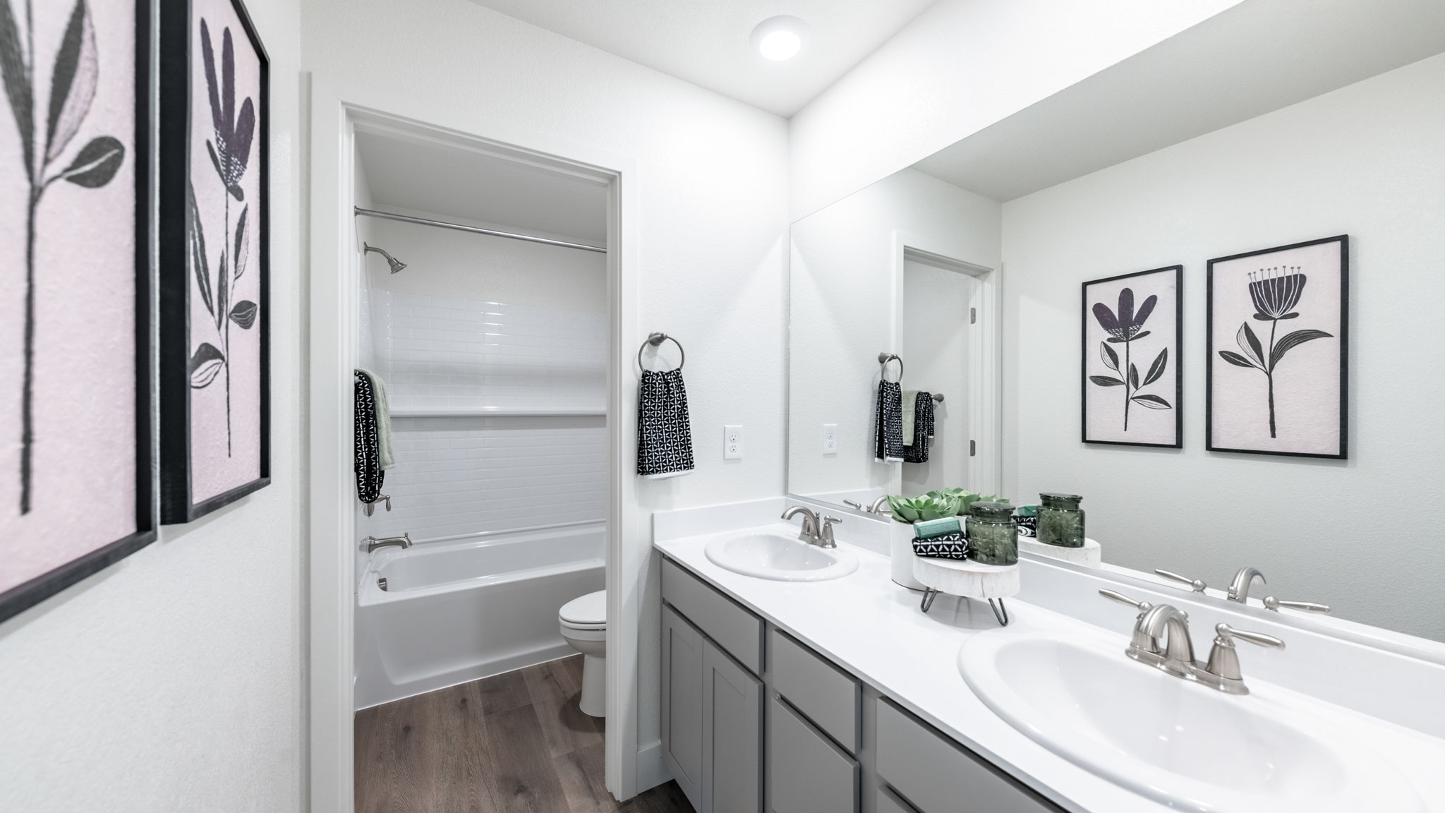 Secondary bathroom with separate room for toilet and bathtub and shower combo