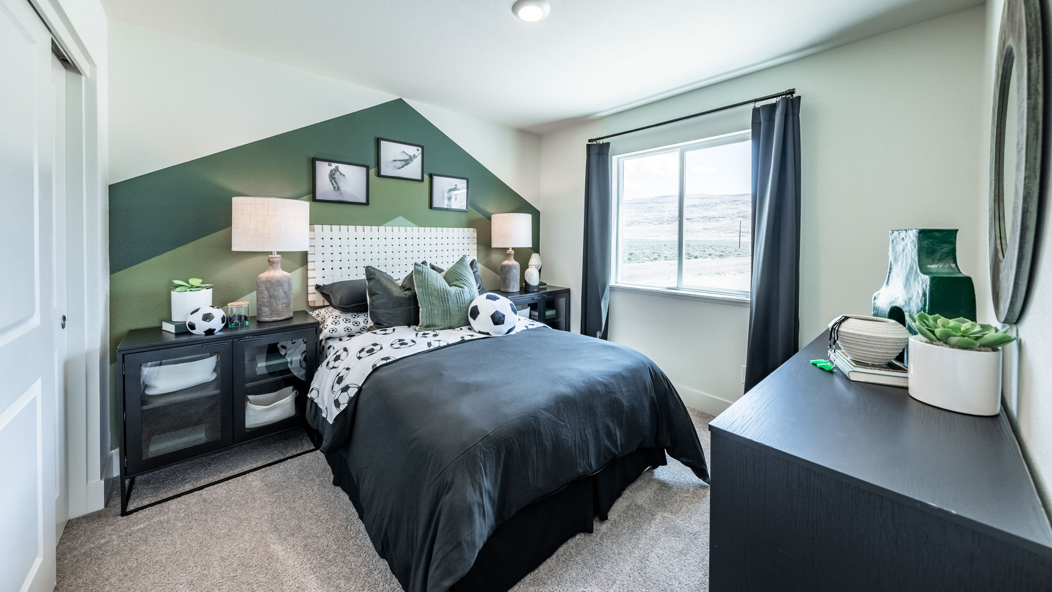 Kid's bedroom with carpeted floor and large window