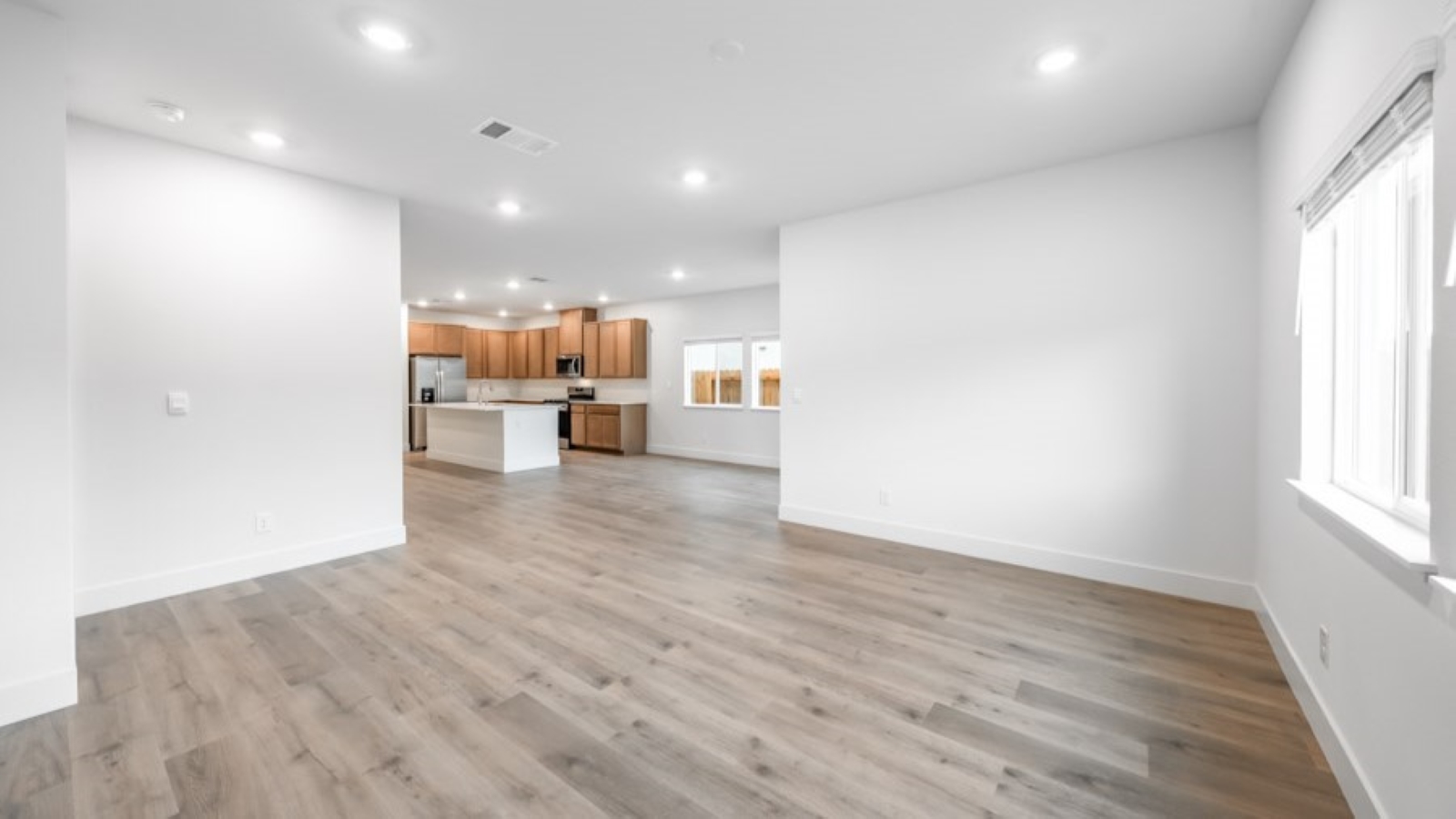 Living room looking out to dining and kitchen area