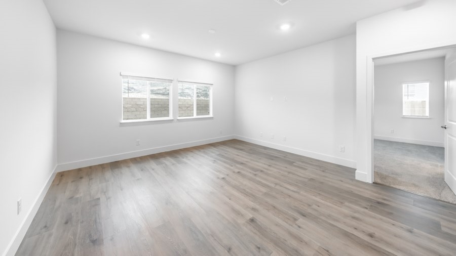 Modern living room with large windows next to primary bedroom