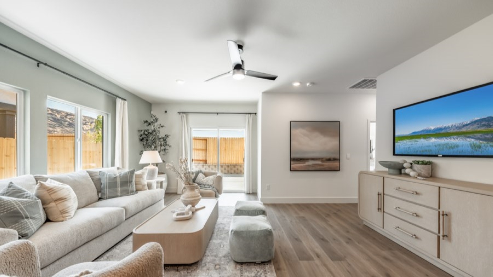 Large living area with a large window and room for a sectional couch