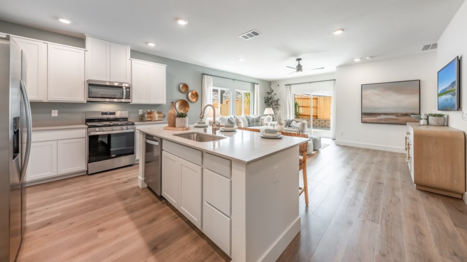Large kitchen with shaker-style cabinets, an island, and stainless steel appliances
