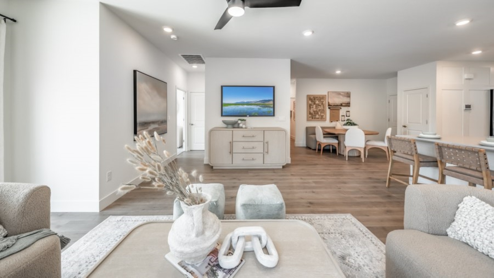 Living room looking towards primary bedroom and dining room