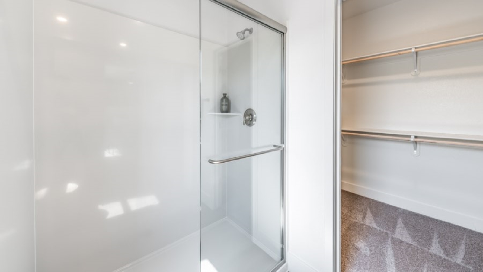 Walk-in shower next to walk-in closet
