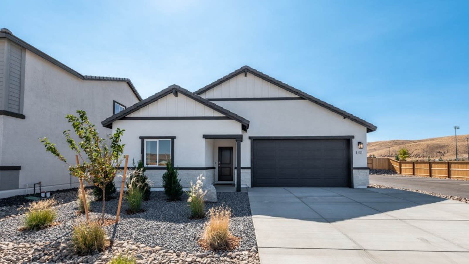 Overland rendered single-story elevation with black and white exterior