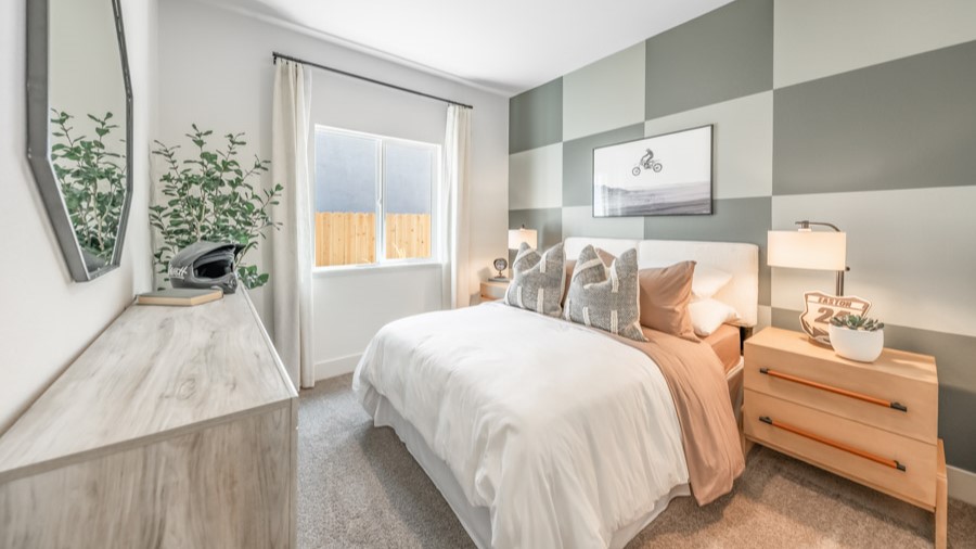 Carpeted secondary bedroom decorated for teenager with dirt bike theme