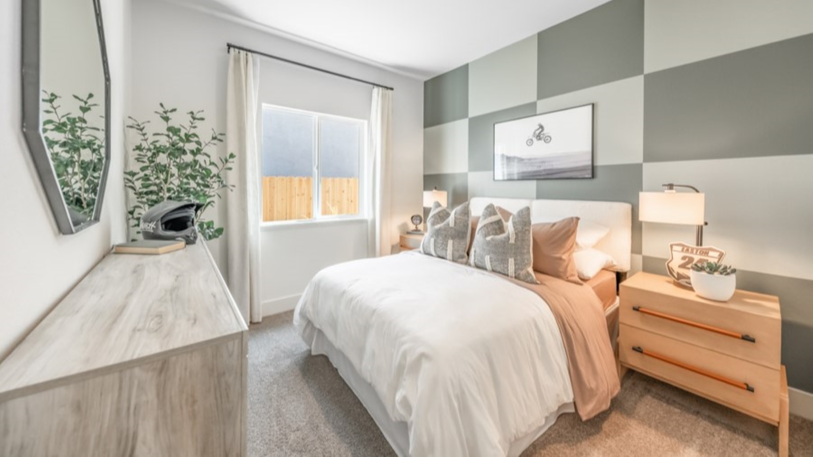 Carpeted secondary bedroom decorated for teenager with dirt bike theme