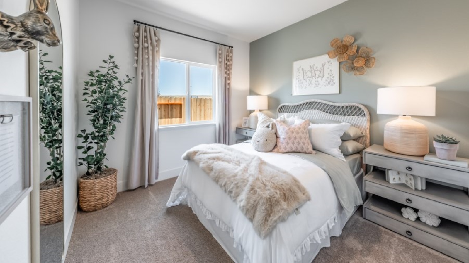 Bedroom decorated for a child with carpeted floor and large window