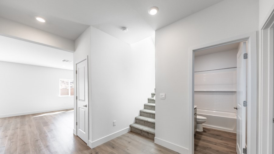 Entry to the Stampede floorplan with a bedroom and bathroom at the front of the home