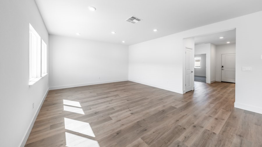 Open-concept first floor living room with bright natural light