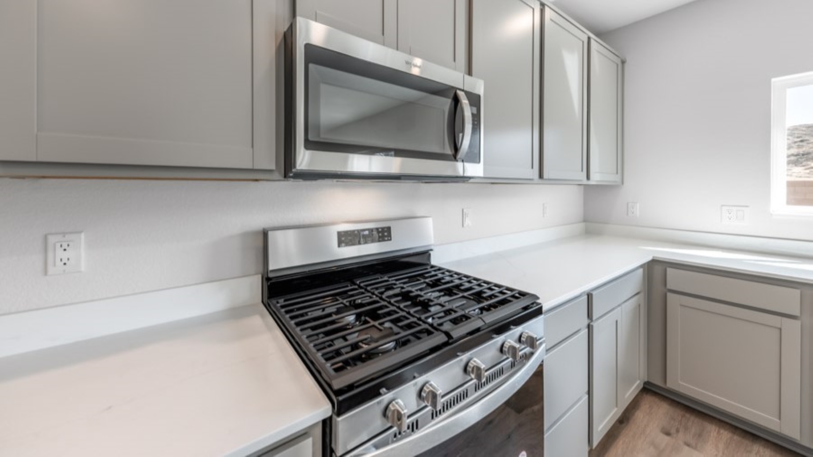 Stainless-steel appliances in modern kitchen