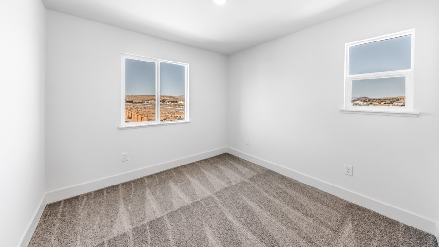 Secondary bedroom with carpet