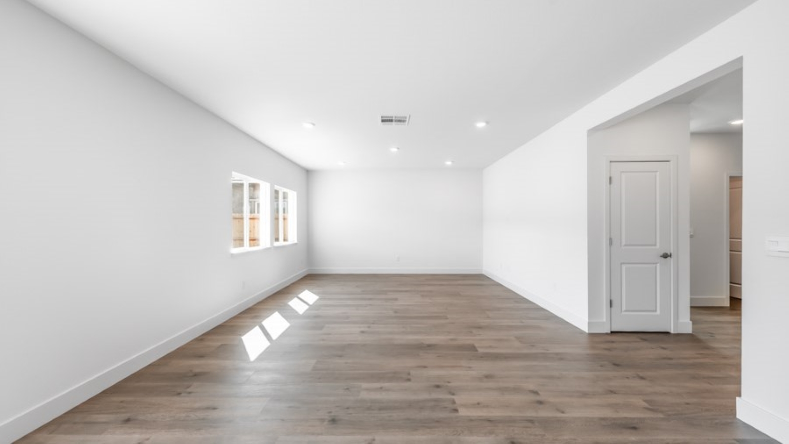 Open-concept first floor living room with bright natural light