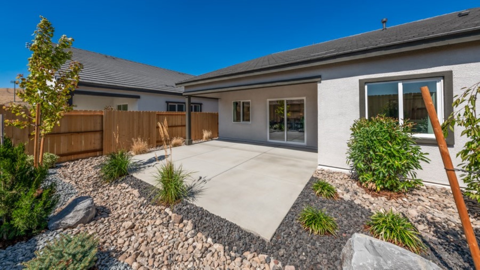 Landscaped backyard and covered patio