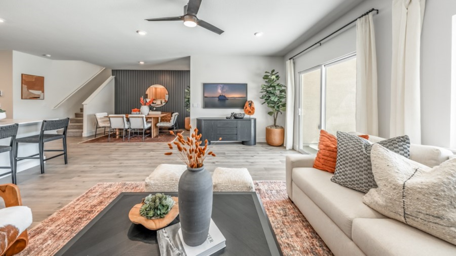 Modern living room with windows looking out into back yard