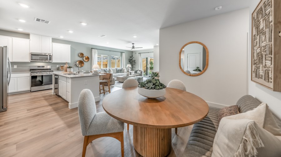 Dining area next to kitchen and living room