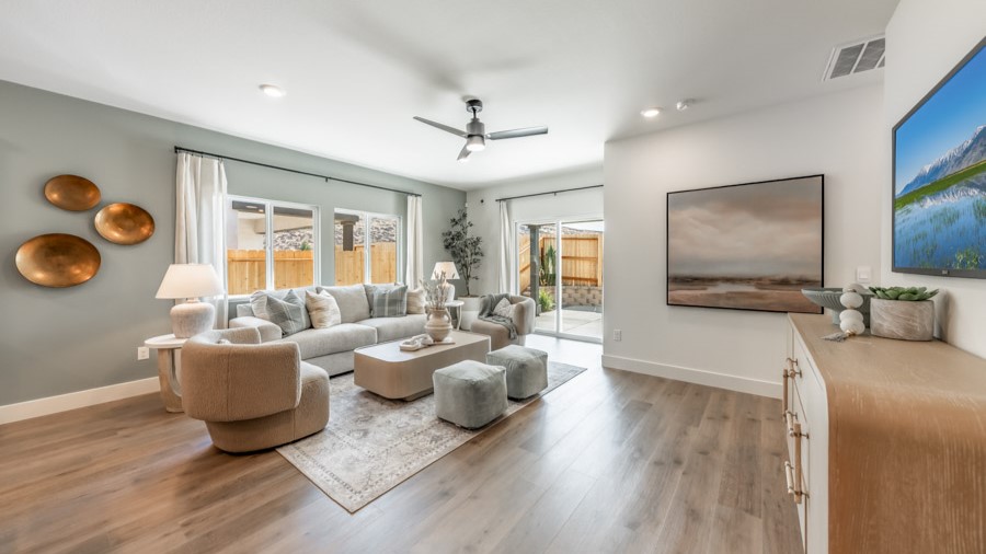 Large living area with a large window and room for a sectional couch