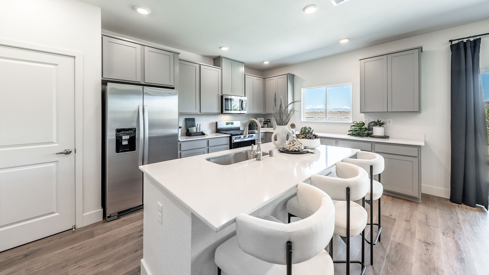 Kitchen with pantry and kitchen island with seating