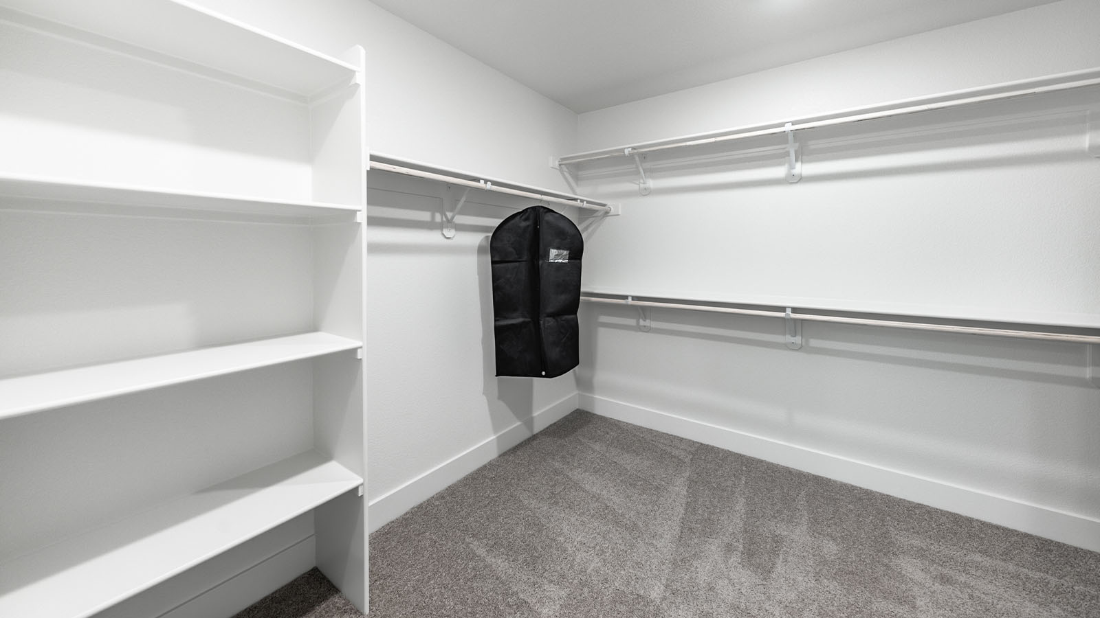 Large walk-in closet with built-in shelves