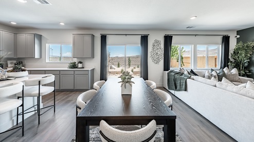 Kitchen, living, and dining area next to back patio door