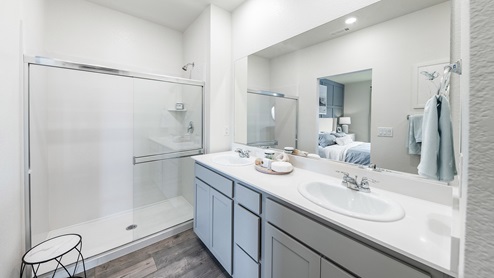 Primary bathroom with shower and double vanity