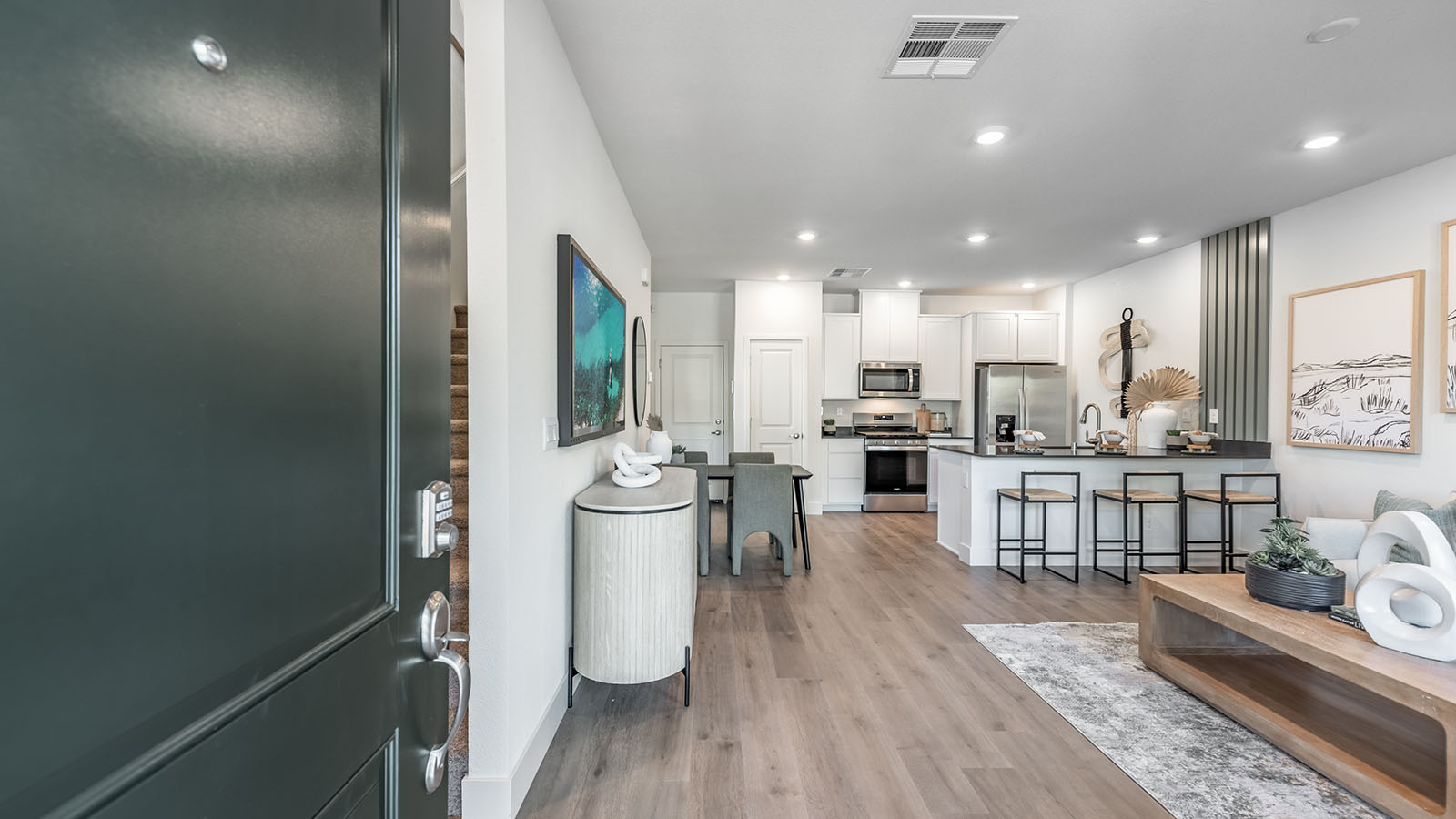Entry of Walker floorplan that opens into open-concept living space