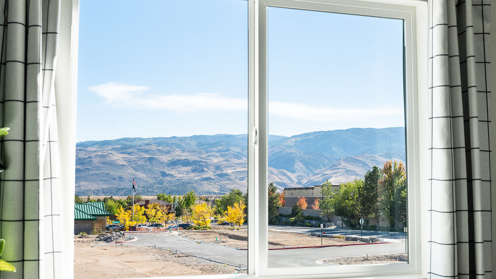 View of the mountains and surrounding city outside primary bedroom window