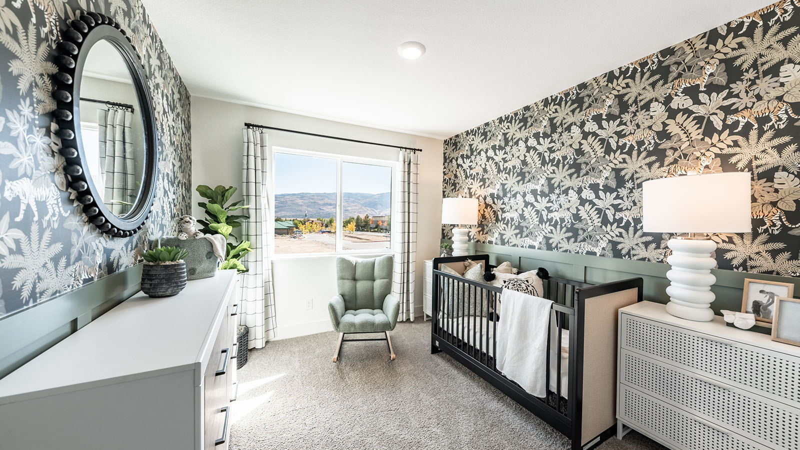Cute modern nursery with beautiful view of mountains outside
