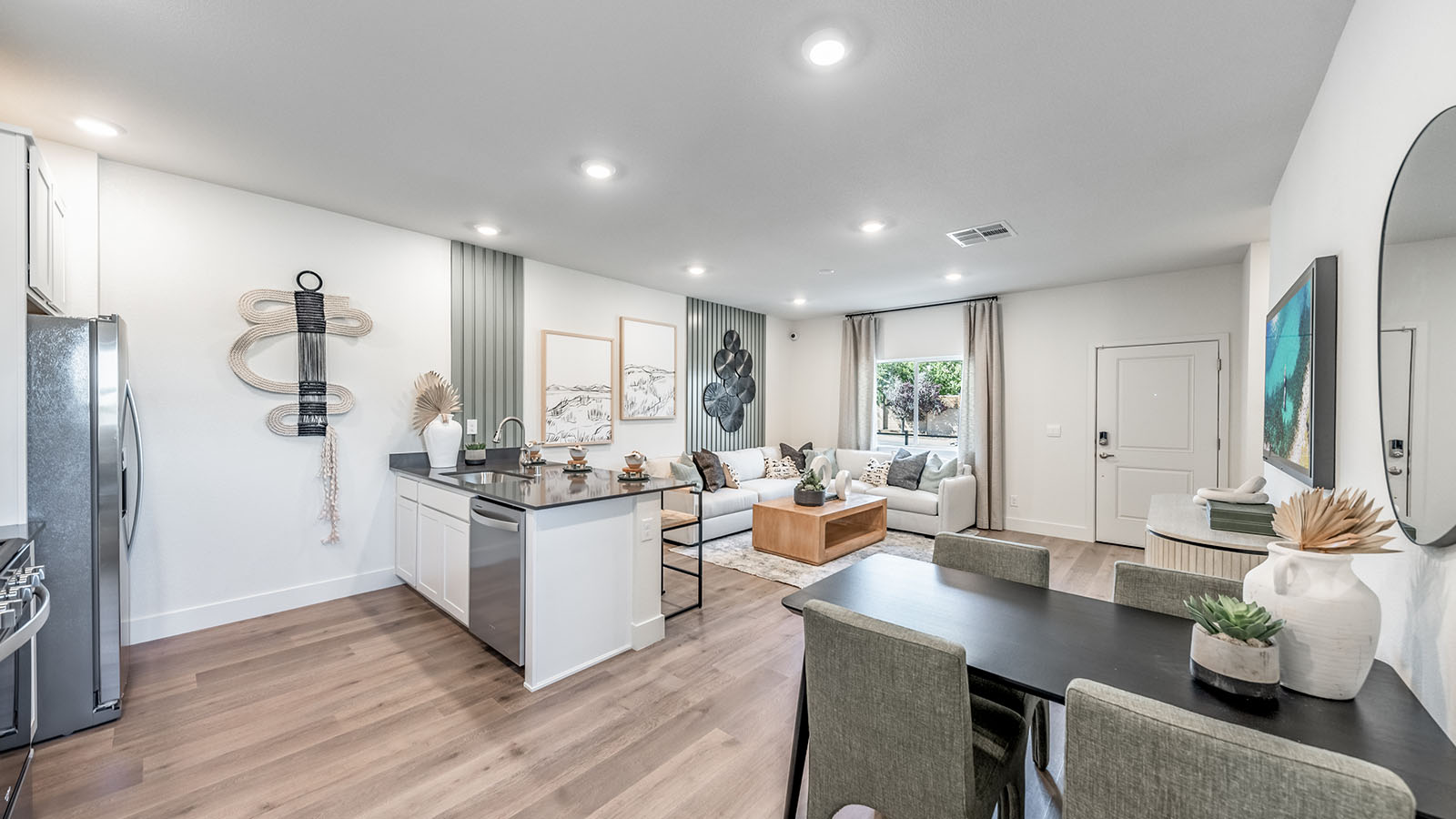 Kitchen looking into living room in open concept first floor