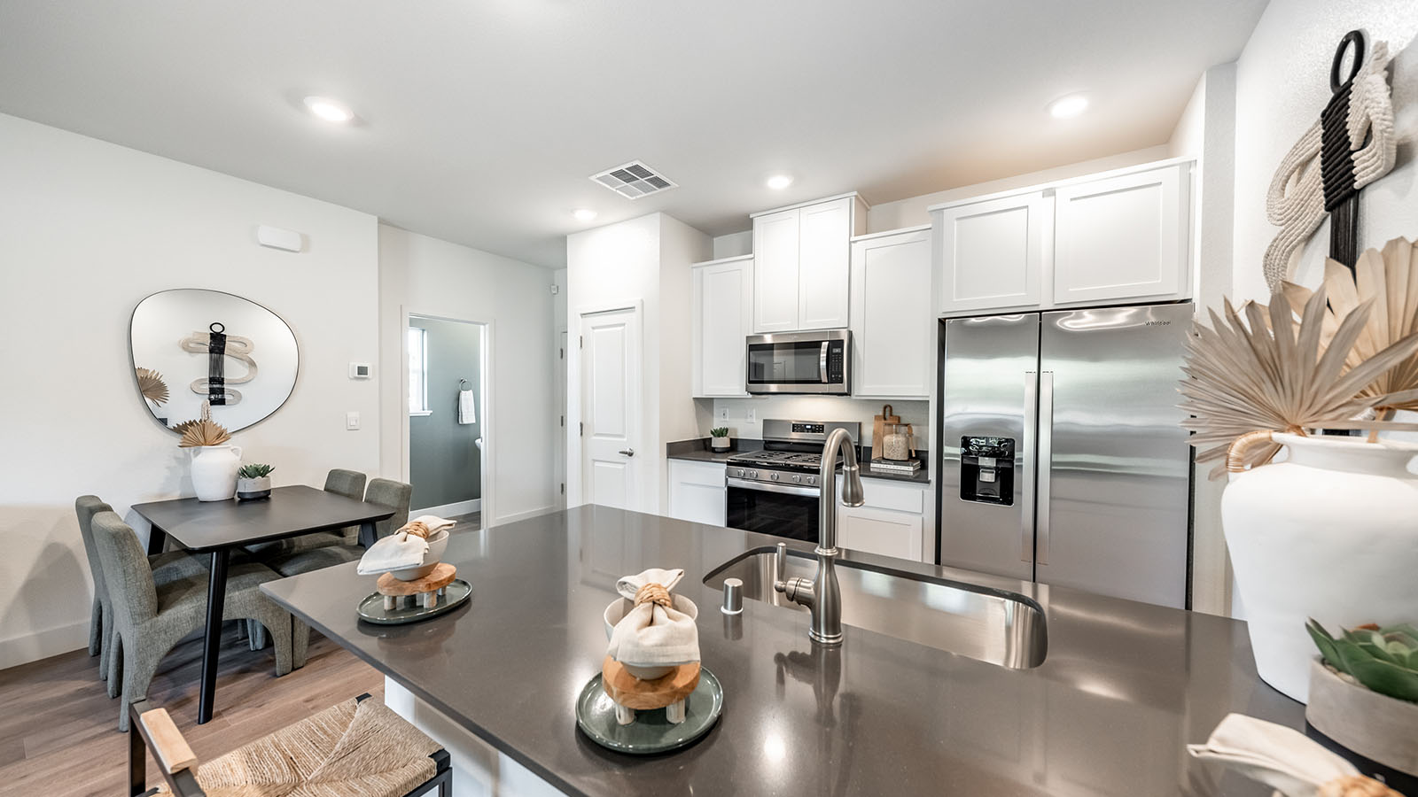 Kitchen peninsula looking into cozy kitchen with pantry