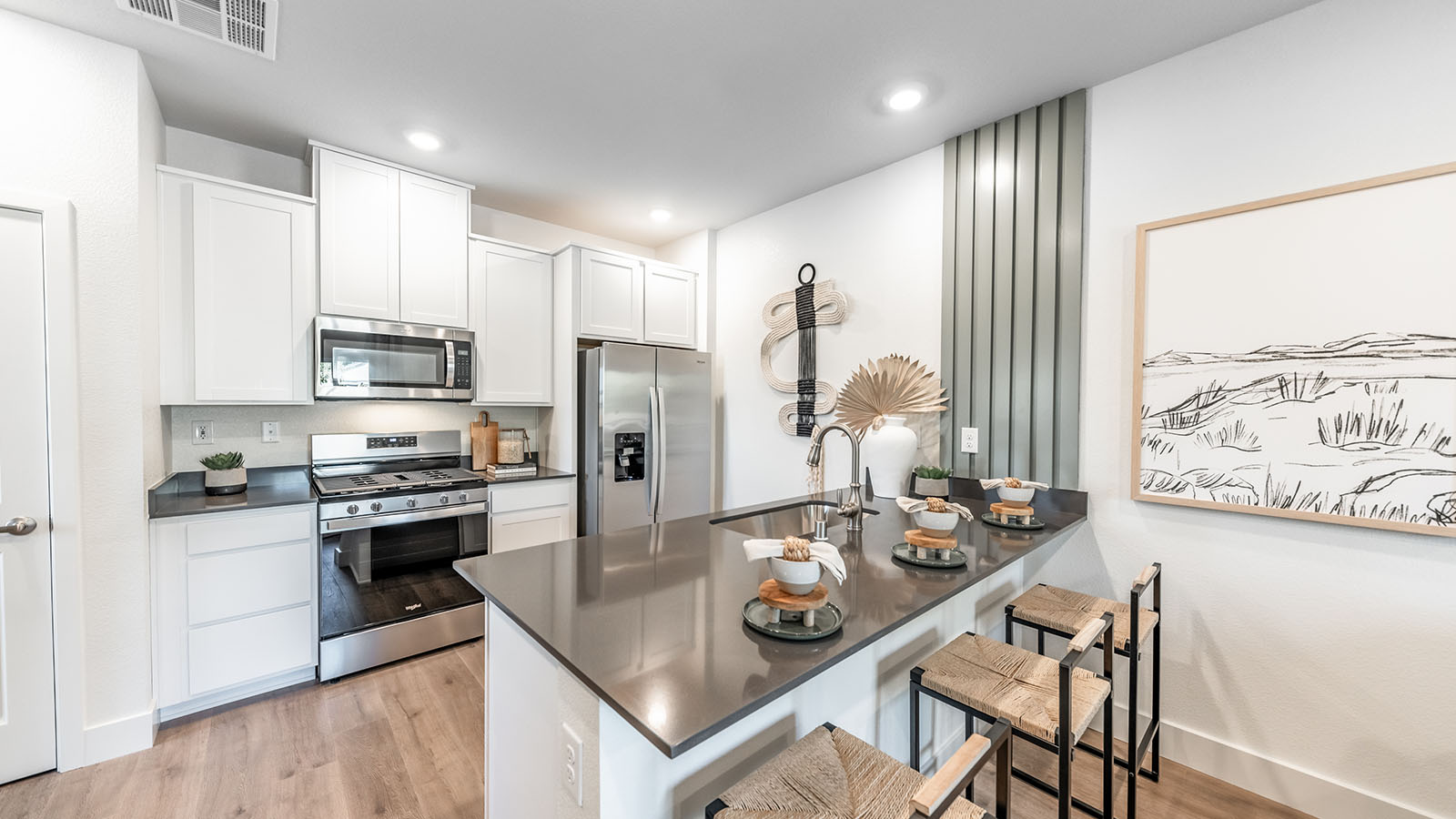 Kitchen with peninsula and shaker-style cbinets