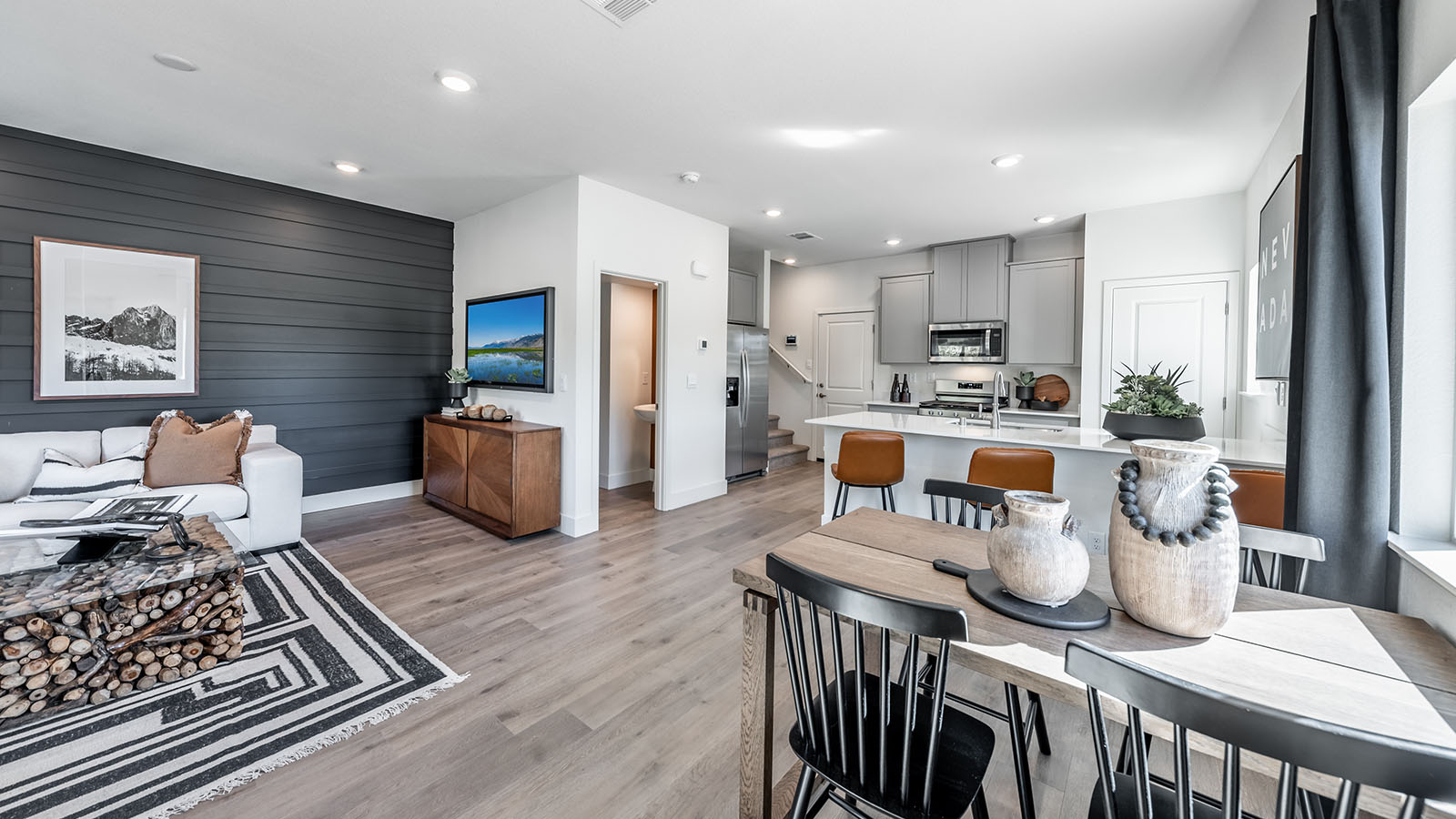 Bright and modern open concept living, dining, and kitchen on first floor of Humboldt plan