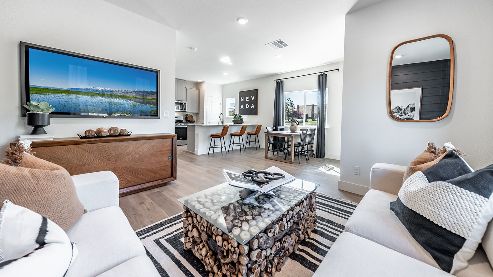 Living room space on first floor with room for sectional couch and television