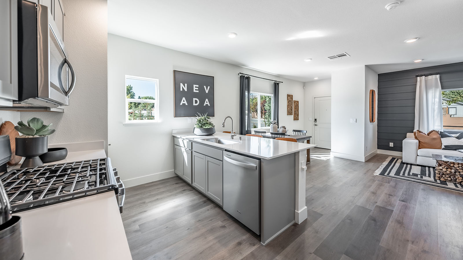 Large windows in the bright kitchen and dining area