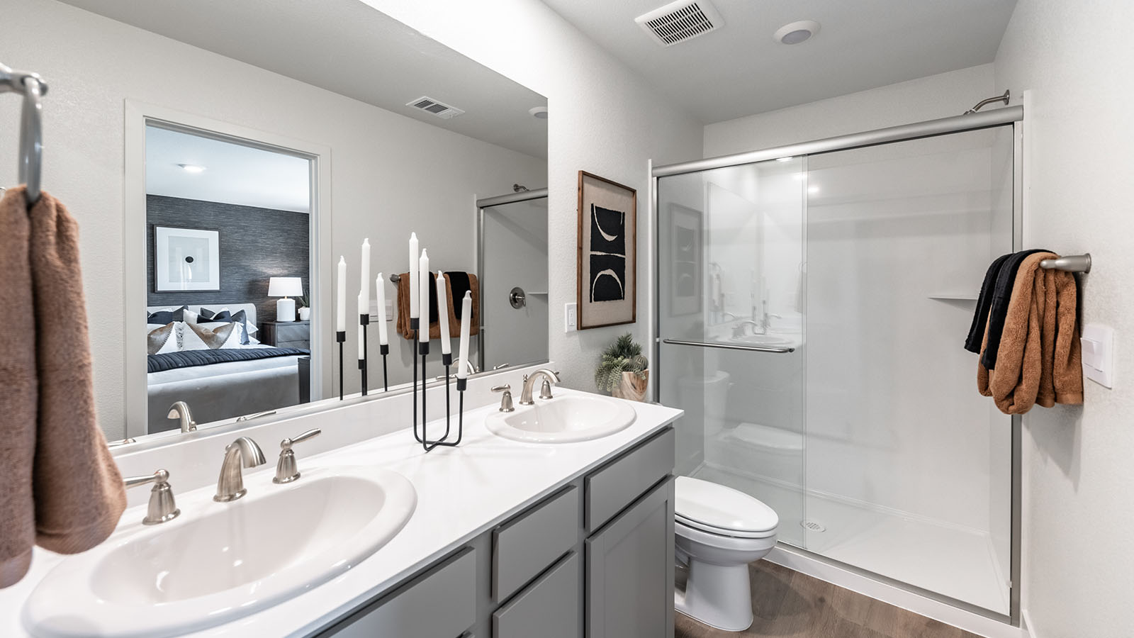 Primary bathroom with double vanity and walk-in shower