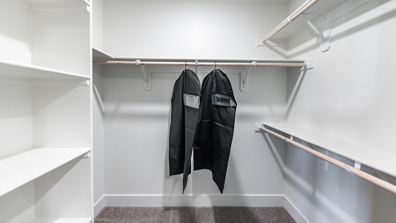 Large walk-in closet with built-in shelves