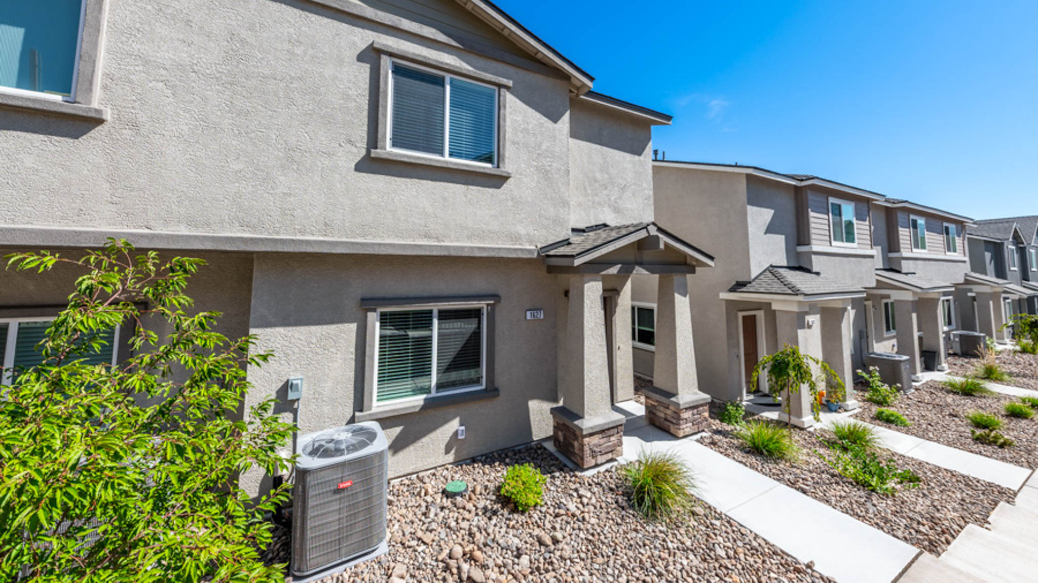 Neighborhood view of modern two-story townhomes at Monarch in Reno Nevada