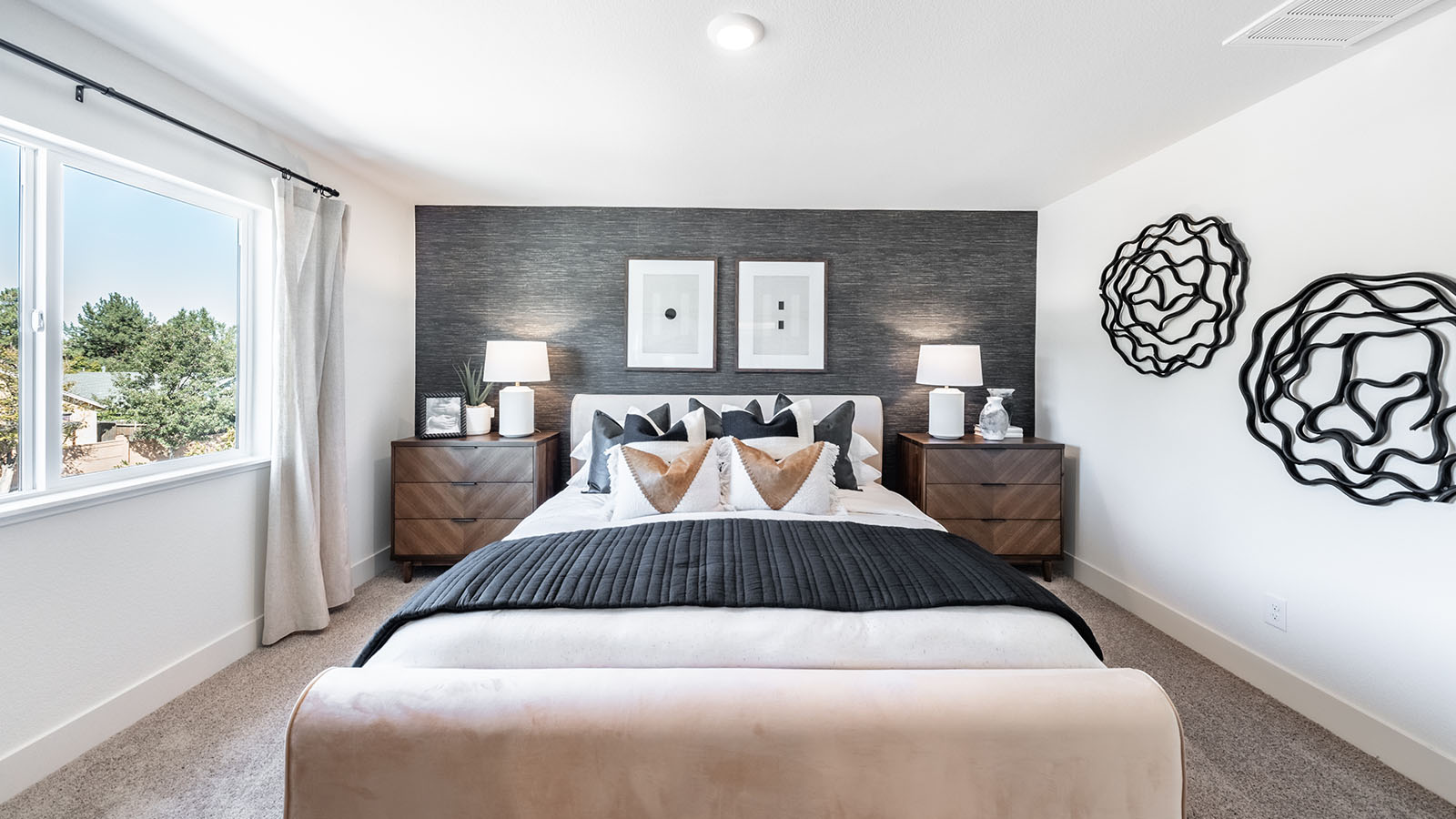 Large bed with bright light coming from large window