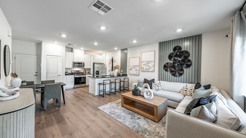Open concept living room, kitchen and dining area with modern design