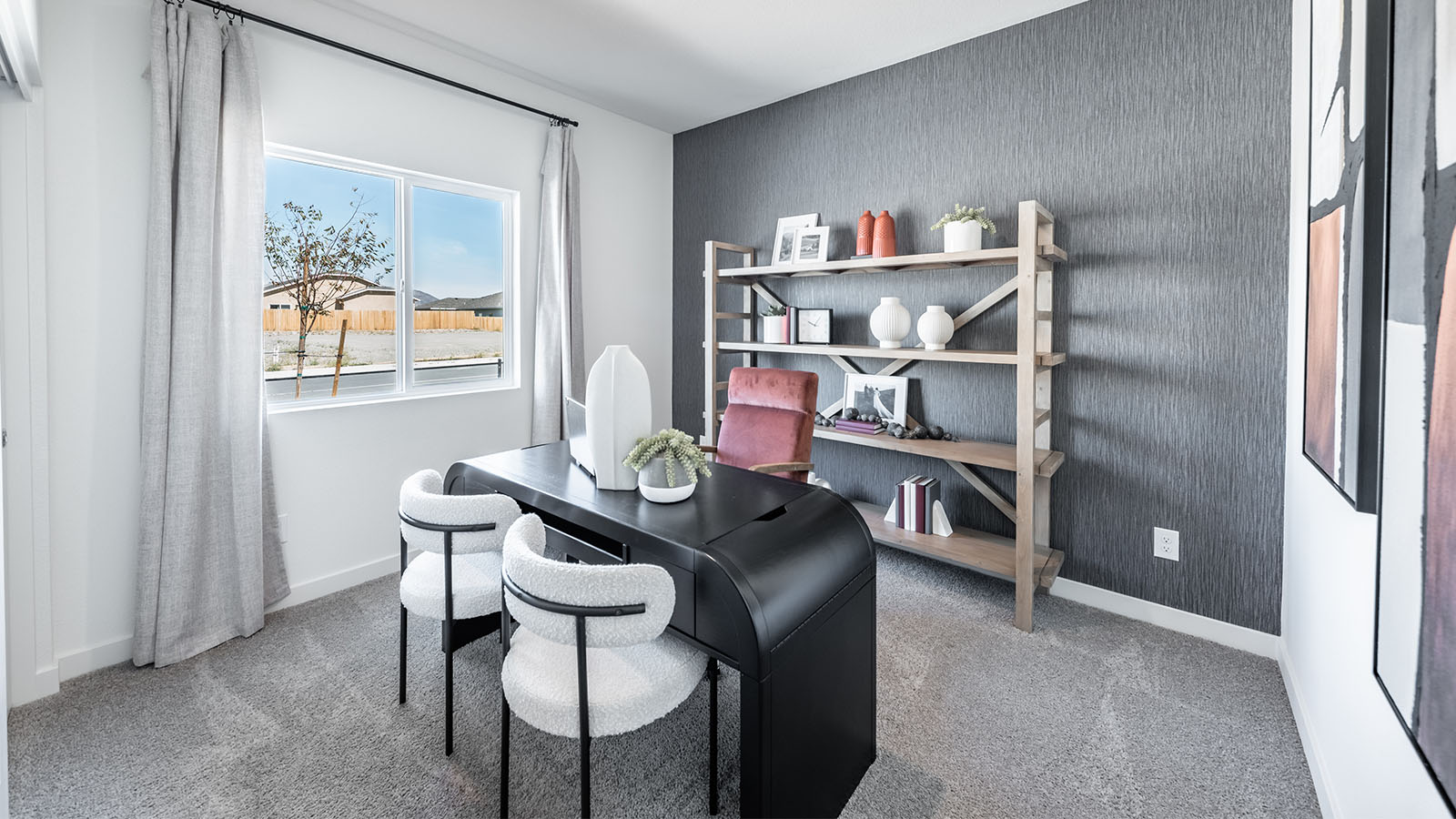 Secondary bedroom with carpet decorated as an office space