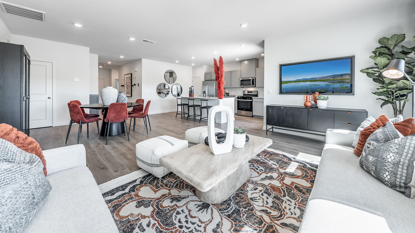 Bright living room looking onto dining area and kitchen