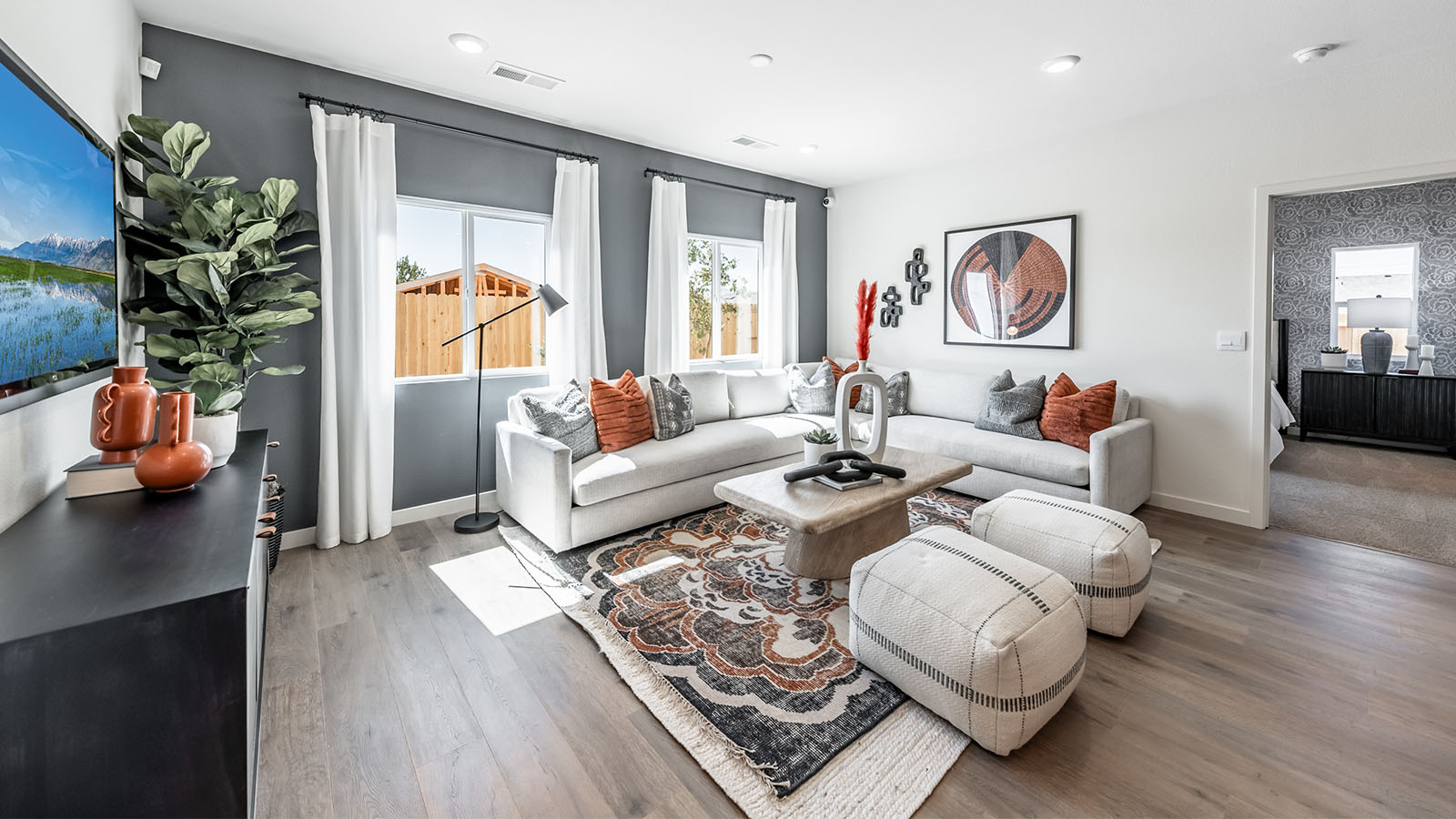 Bright living area that leads to primary bedroom