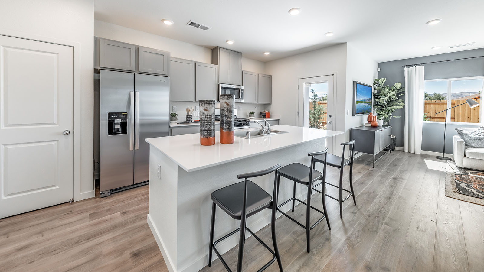 Modern kitchen with patio door leading to back yard
