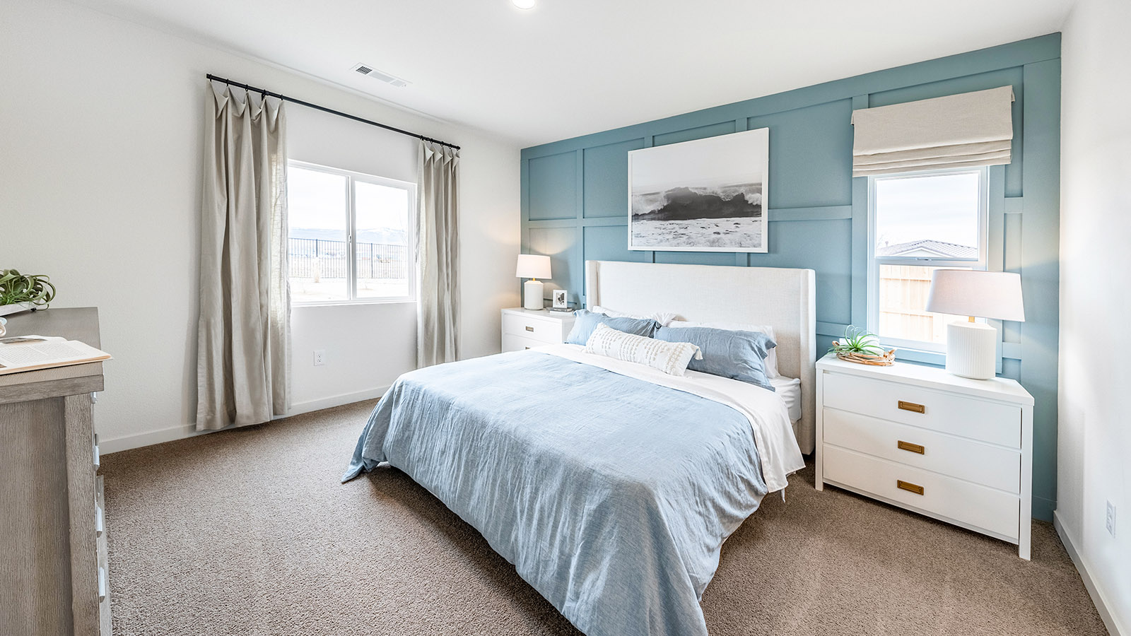 Large primary bedroom with carpeted floor